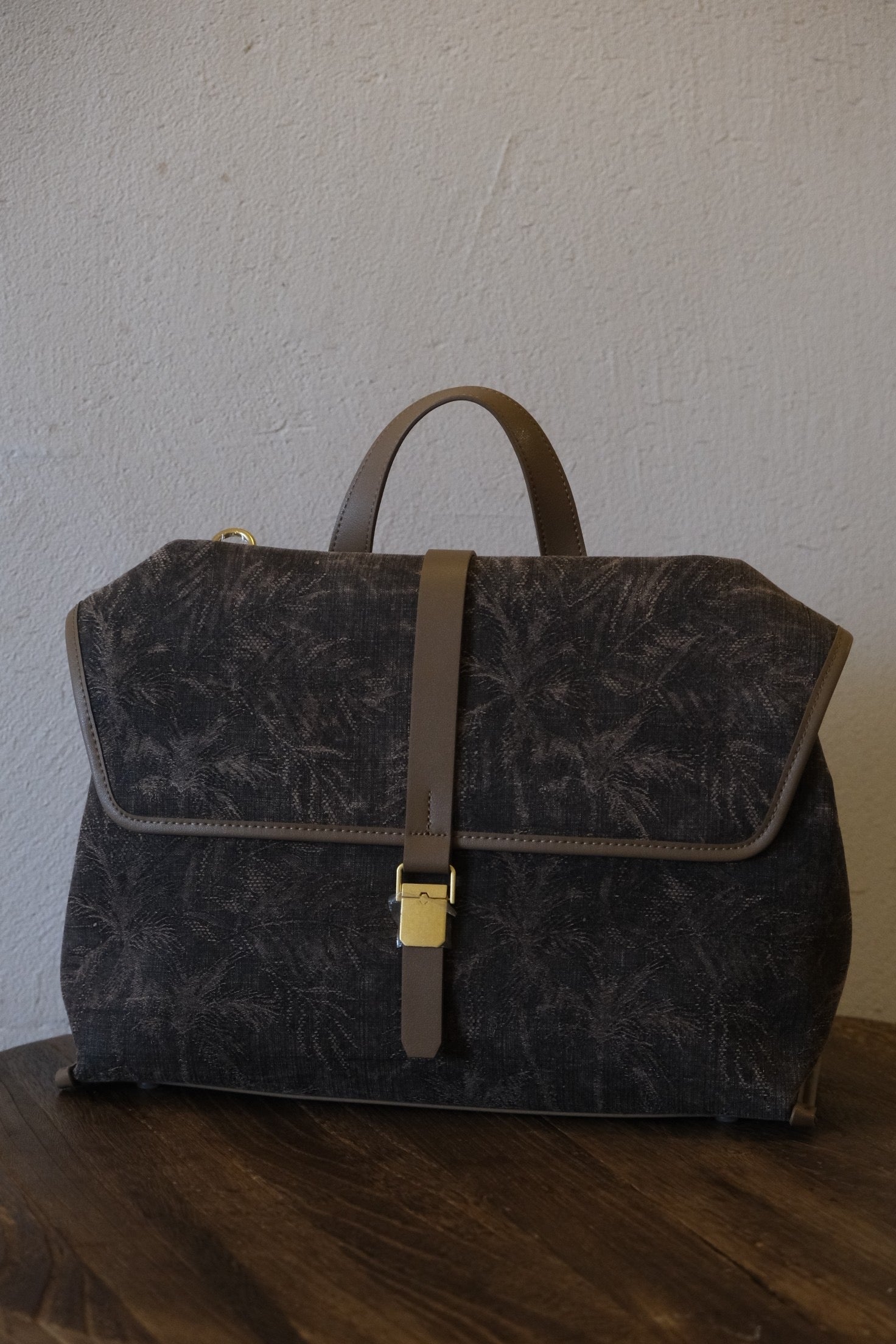 Premium metal hardware details on Xiangyunsha silk leather handbag