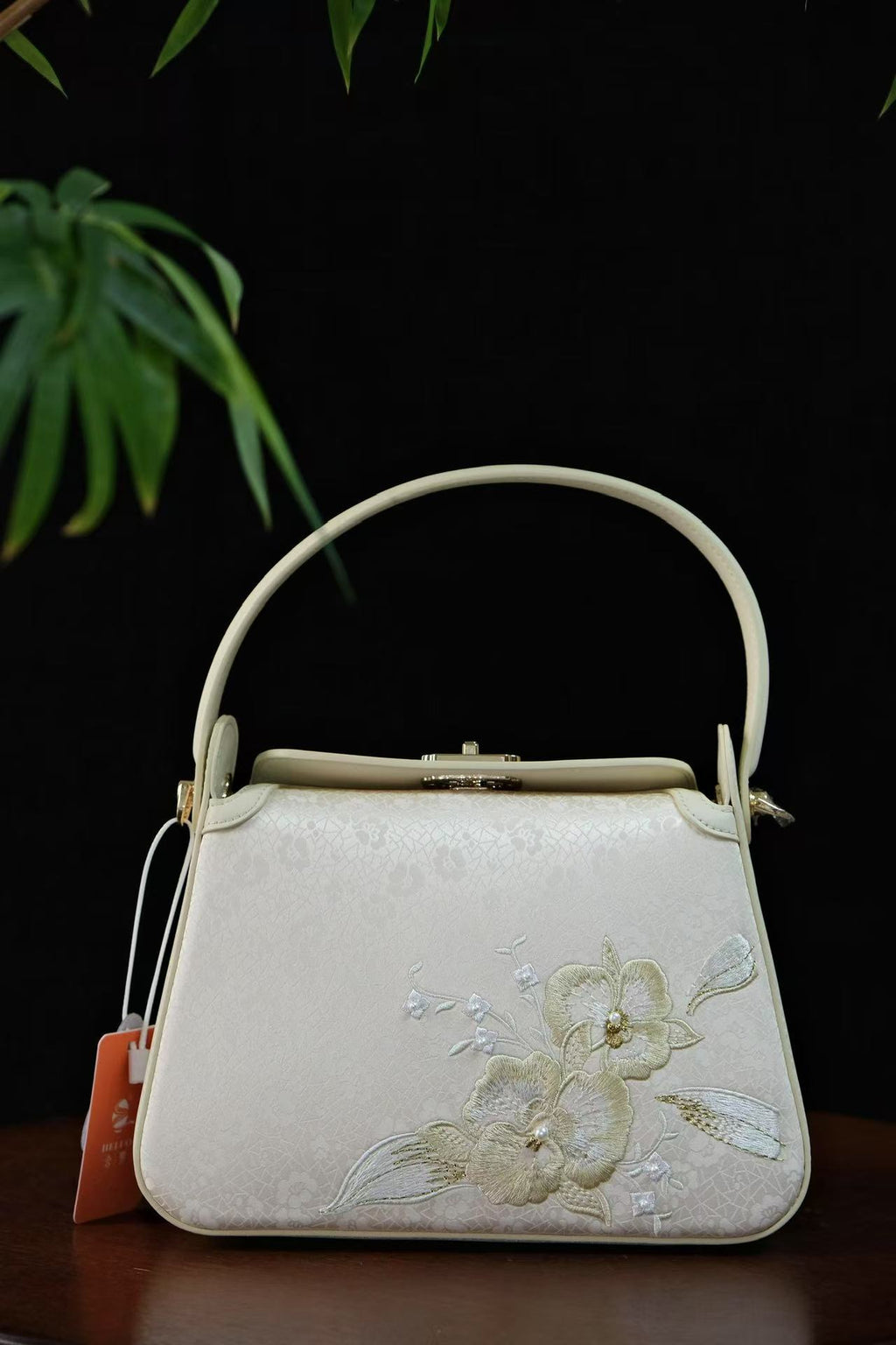 Handcrafted Lingjin silk purse with leather finishing