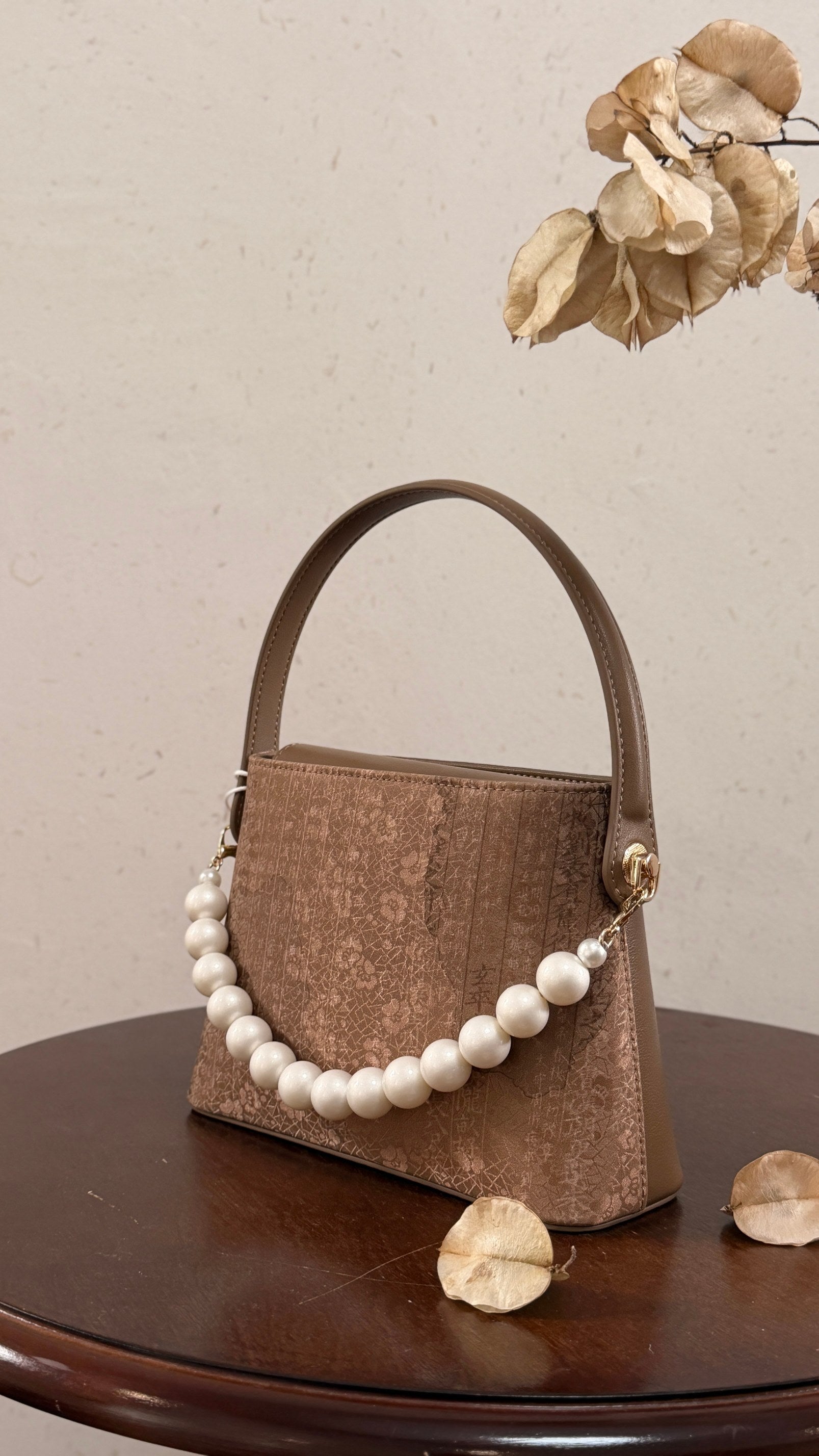 Lingjin silk leather handbag with elegant artisan design