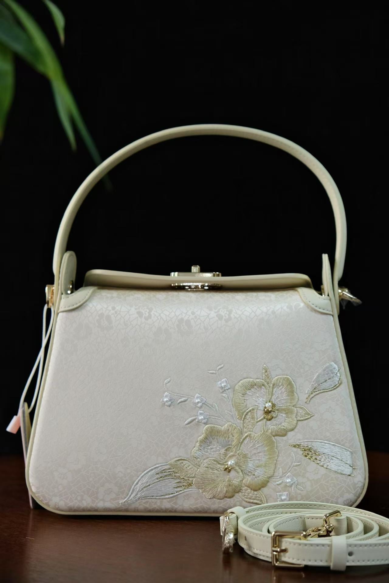 Modern handbag featuring traditional Lingjin silk
