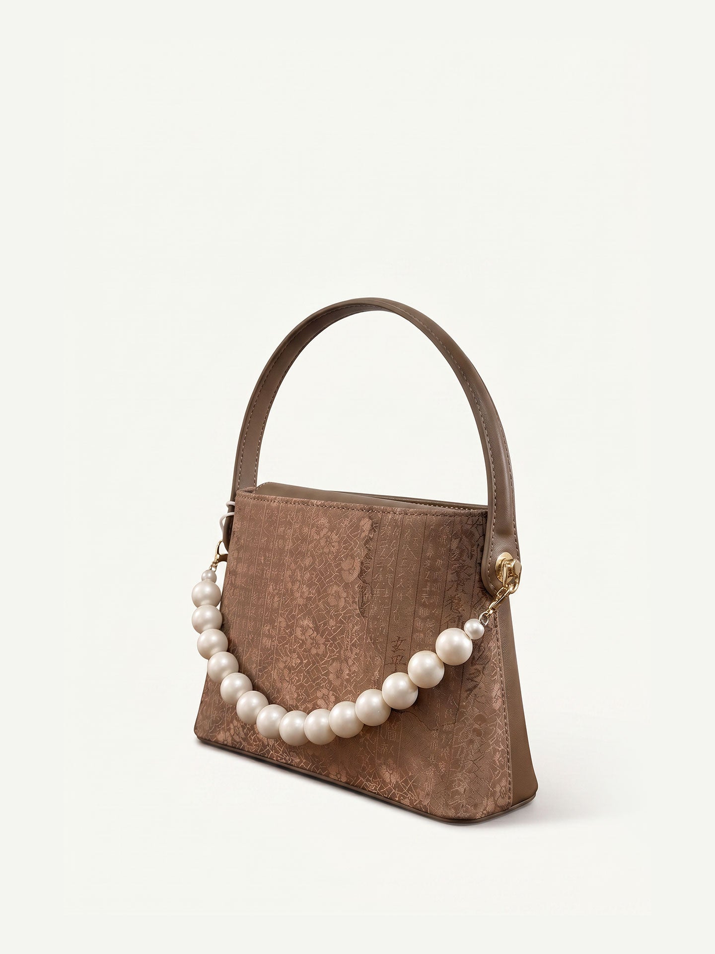 Handmade Lingjin silk handbag with traditional Chinese textile craftsmanship