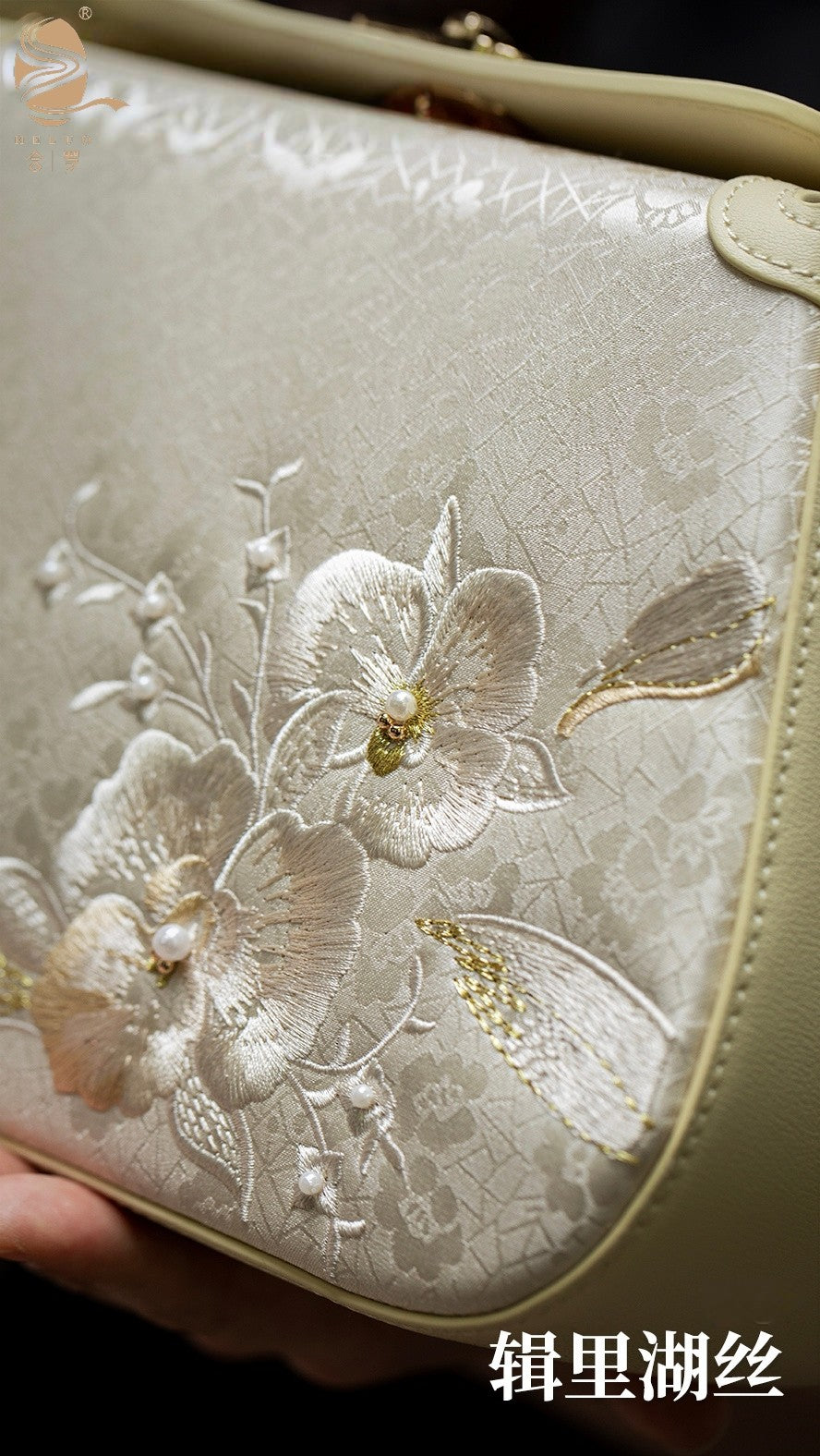 Lingjin silk top handle handbag with elegant design