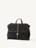 Luxury genuine leather edge details of handcrafted silk handbag