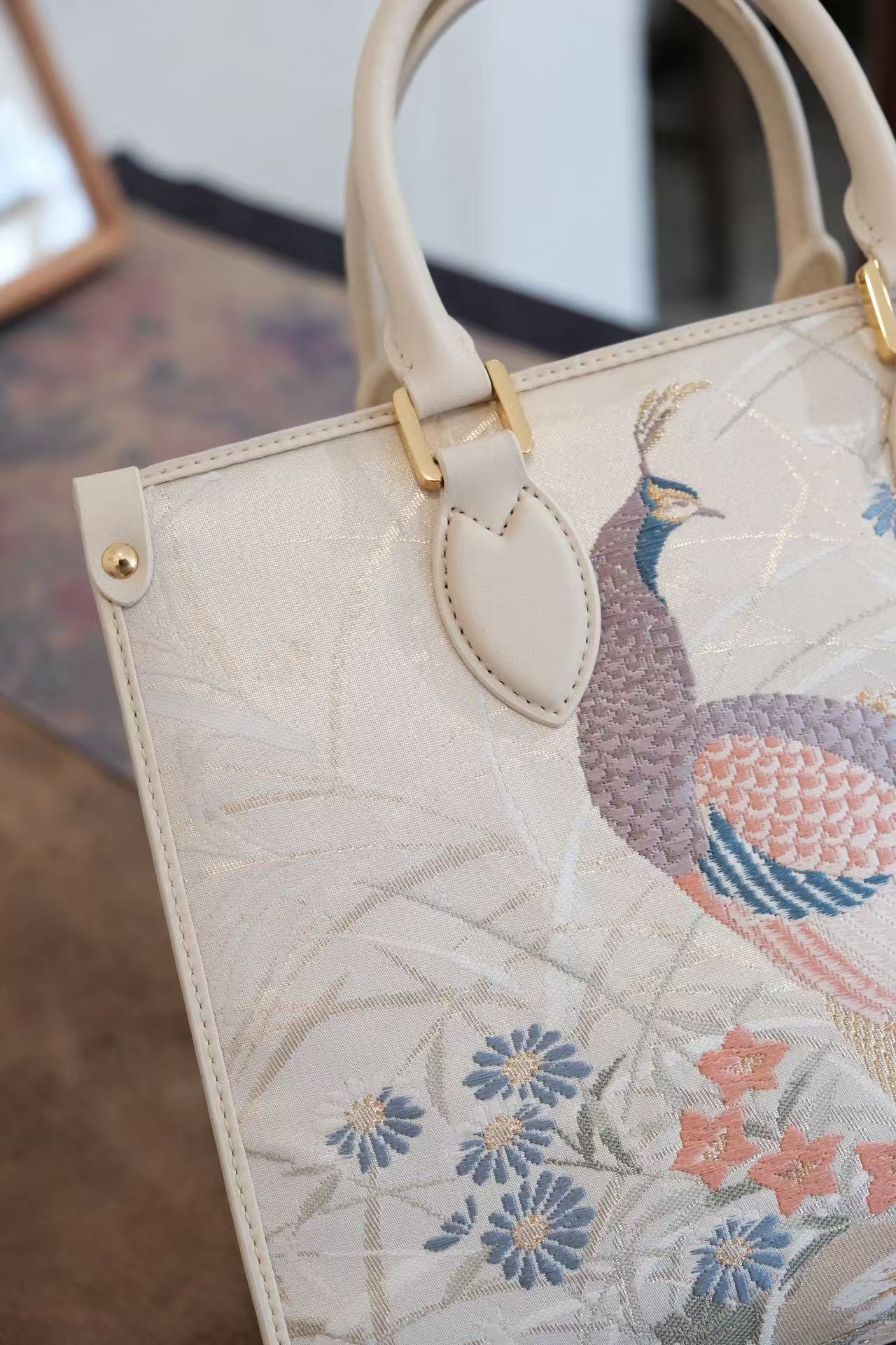 Handcrafted Nishijin silk handbag with genuine leather accents