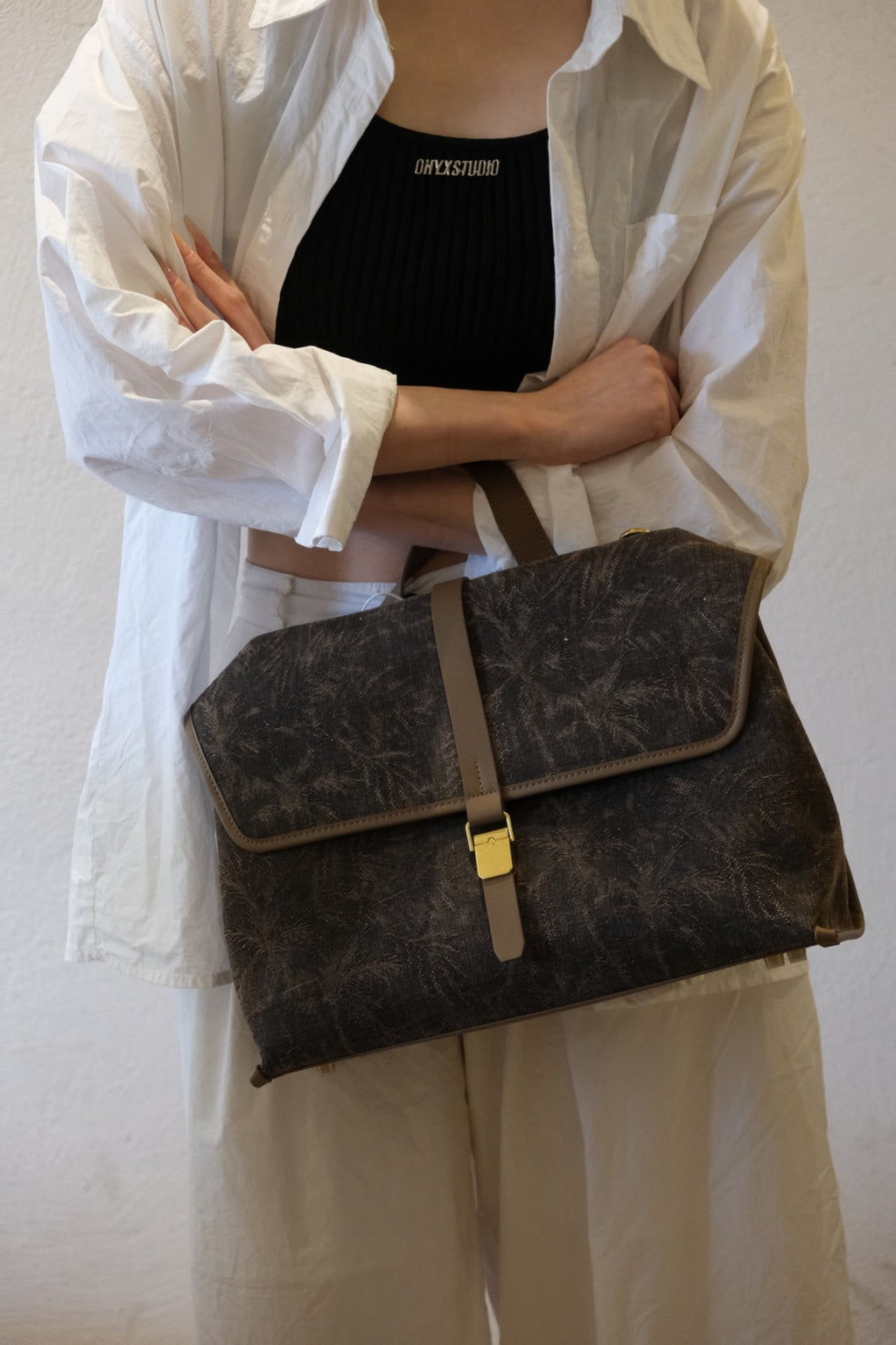 Premium display of Xiangyunsha silk leather handbag with timeless elegance