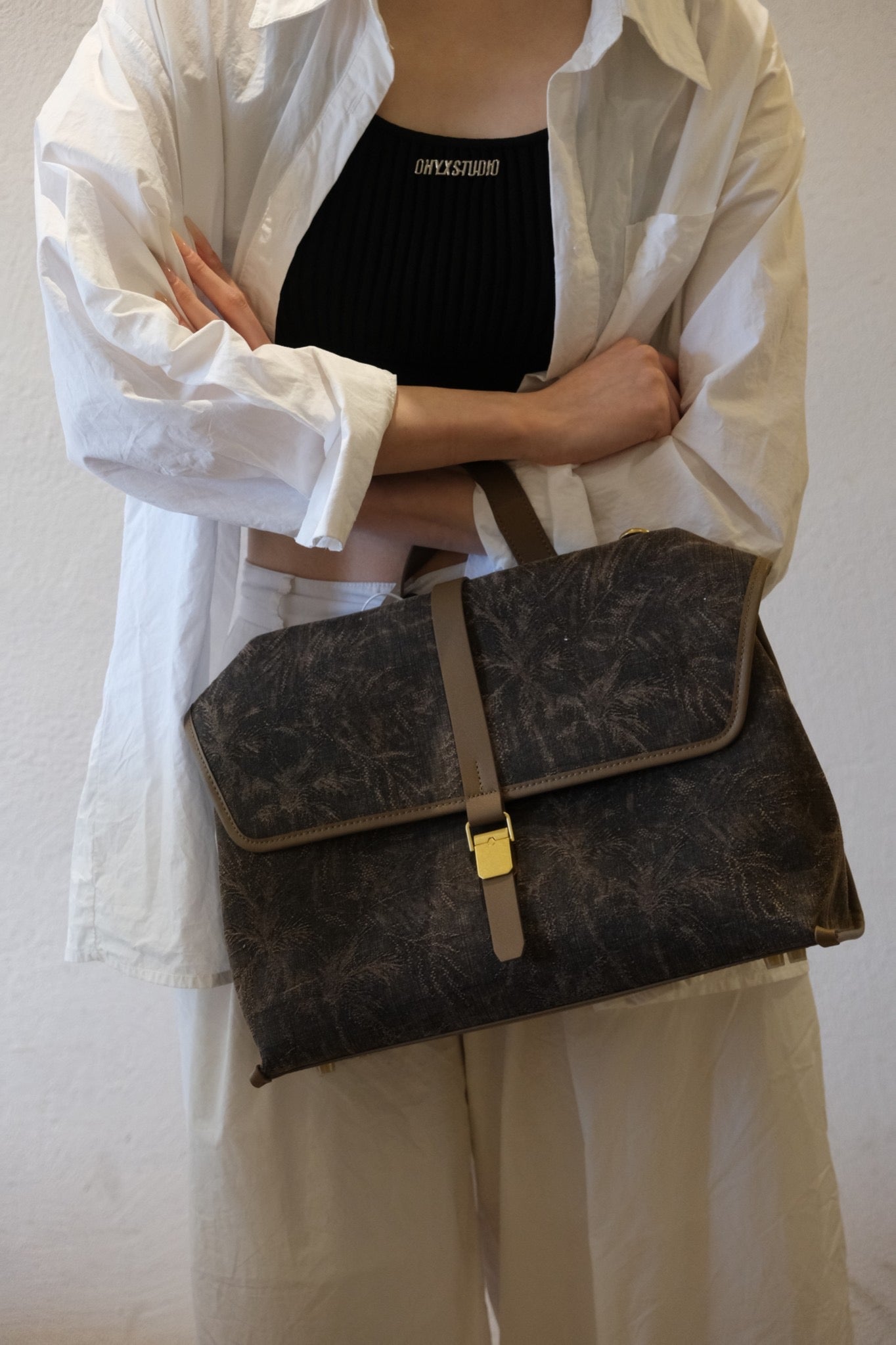 Premium display of Xiangyunsha silk leather handbag with timeless elegance