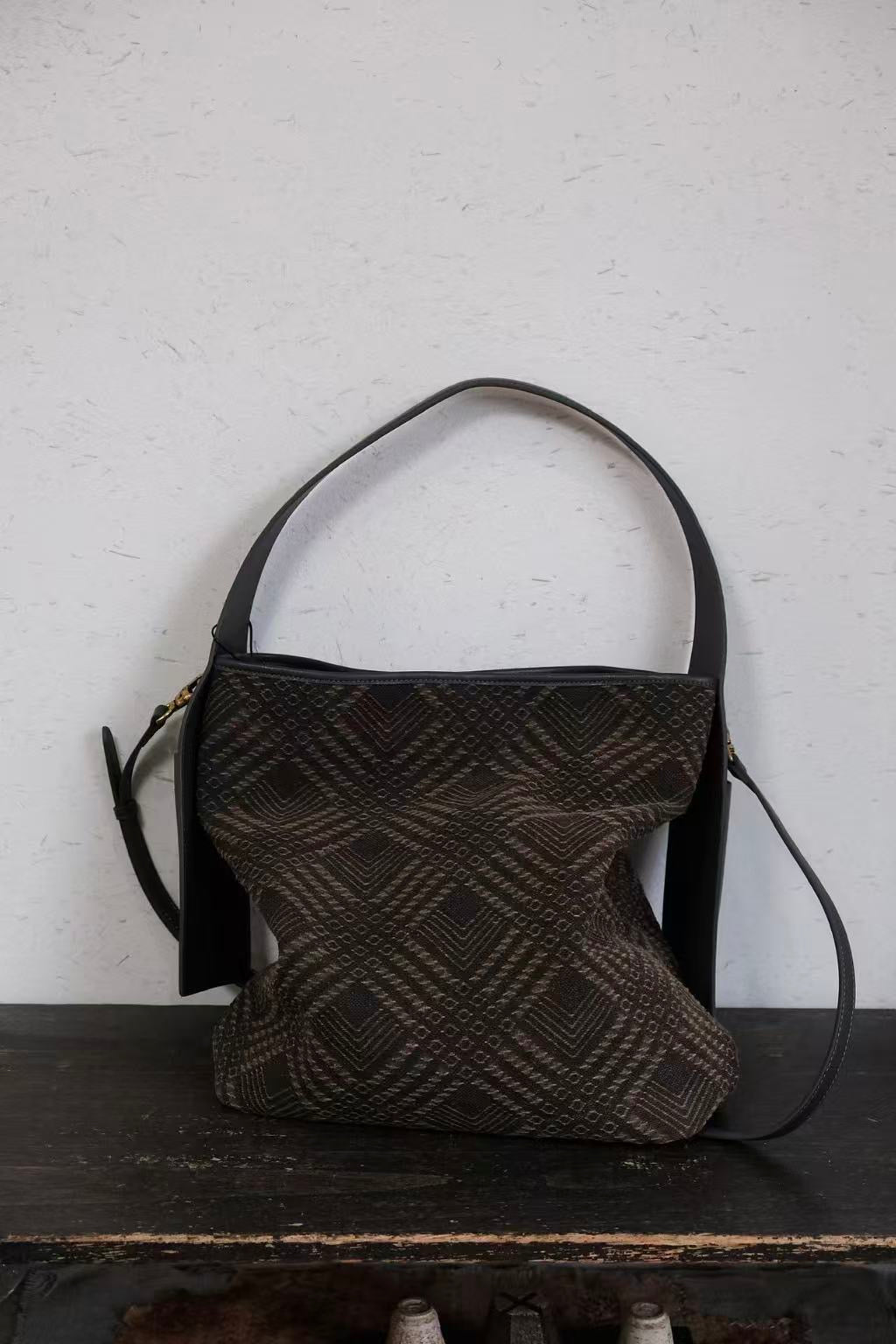 Artisan crafted Xiangyunsha silk handbag with unique texture