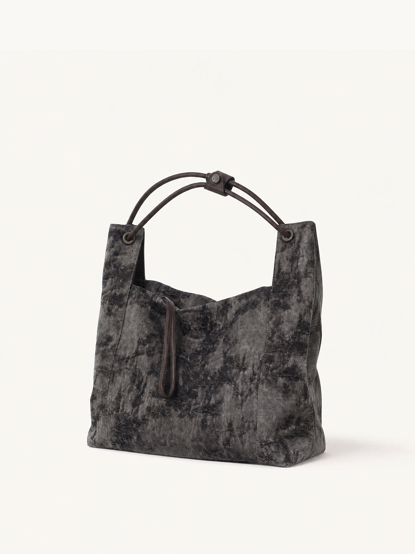 Handcrafted Xiangyunsha silk leather handbag inspired by Chinese heritage craftsmanship